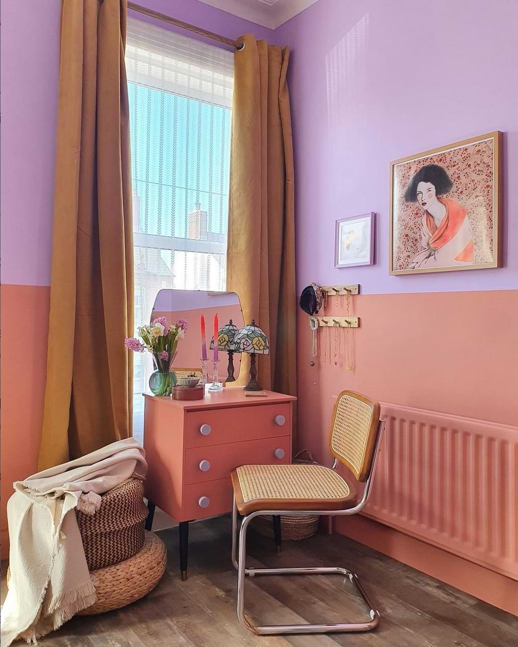 Pink small dressing table in orange and pink bedroom