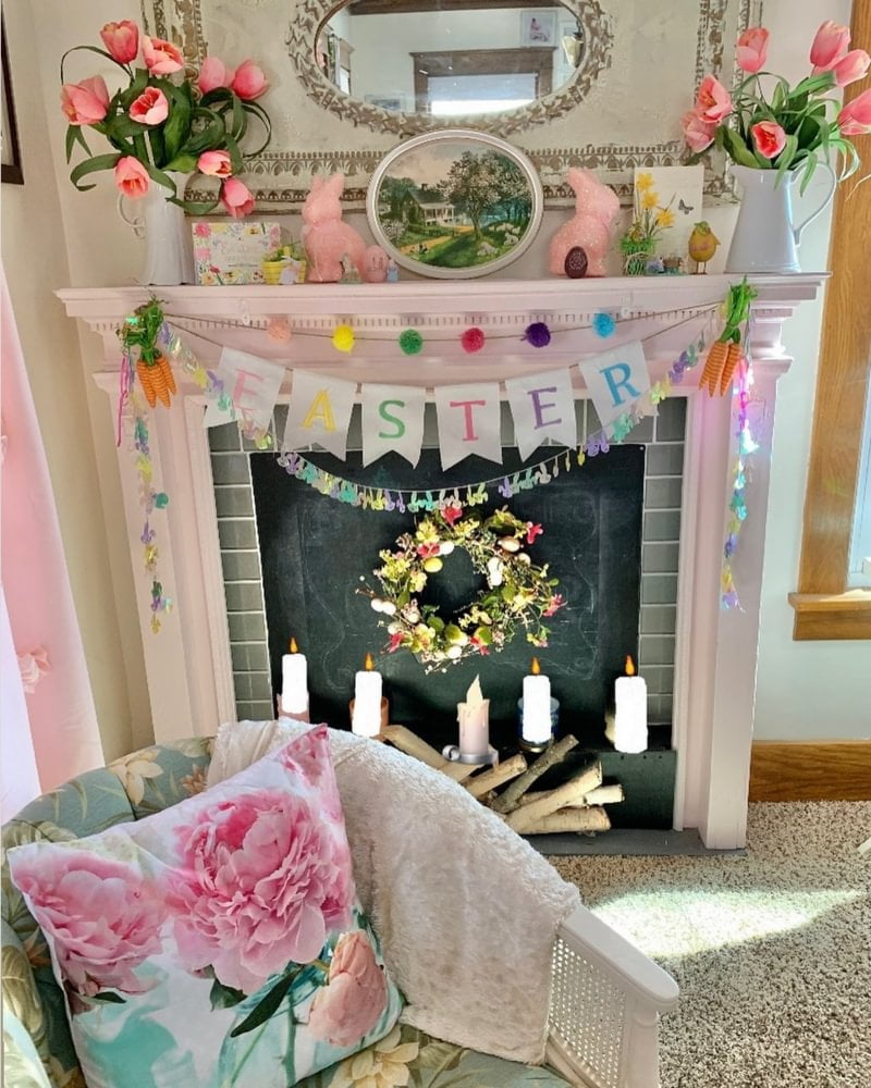 White fireplace with multicolored easter garland and flowers