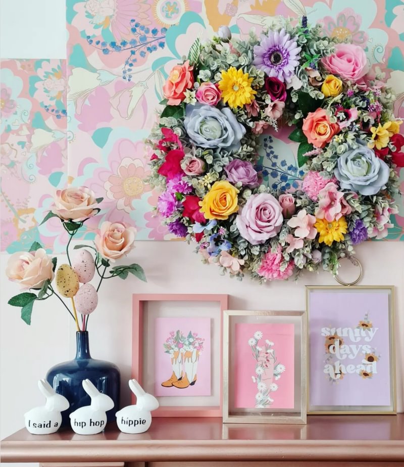 Bright coloruful floral wreath with small easter themed prints and bunny decor