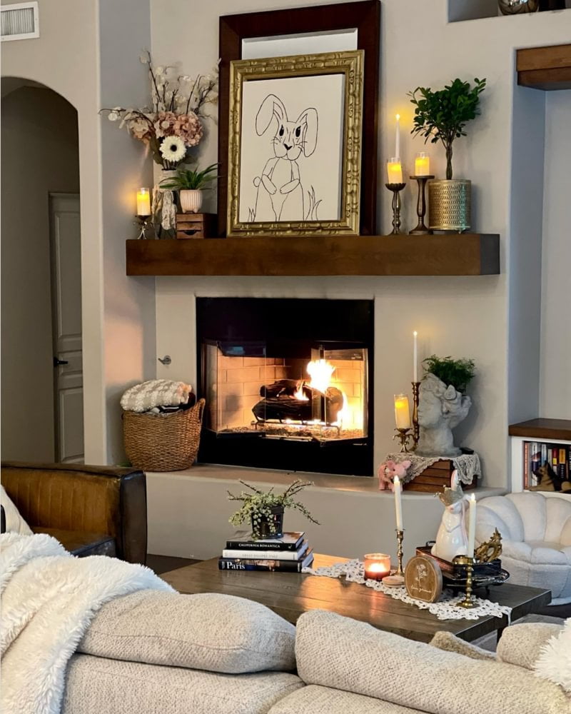 Moody neutral fireplace with linework bunny art on top
